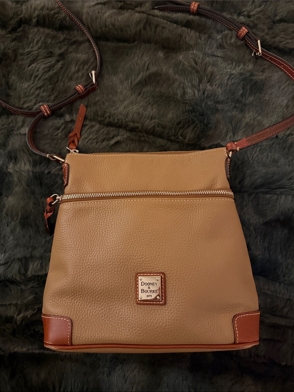 Dooney & Bourke Pebble Leather Crossbody in the color sand I believe